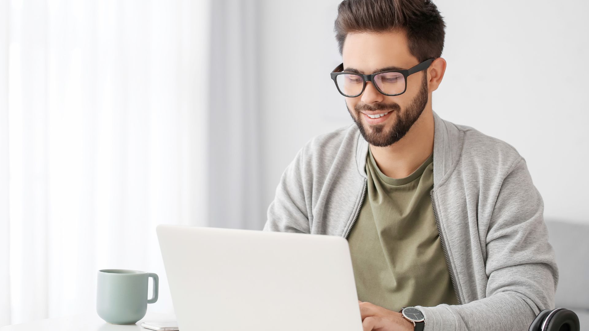 A man researches the best compliance courses for his team.
