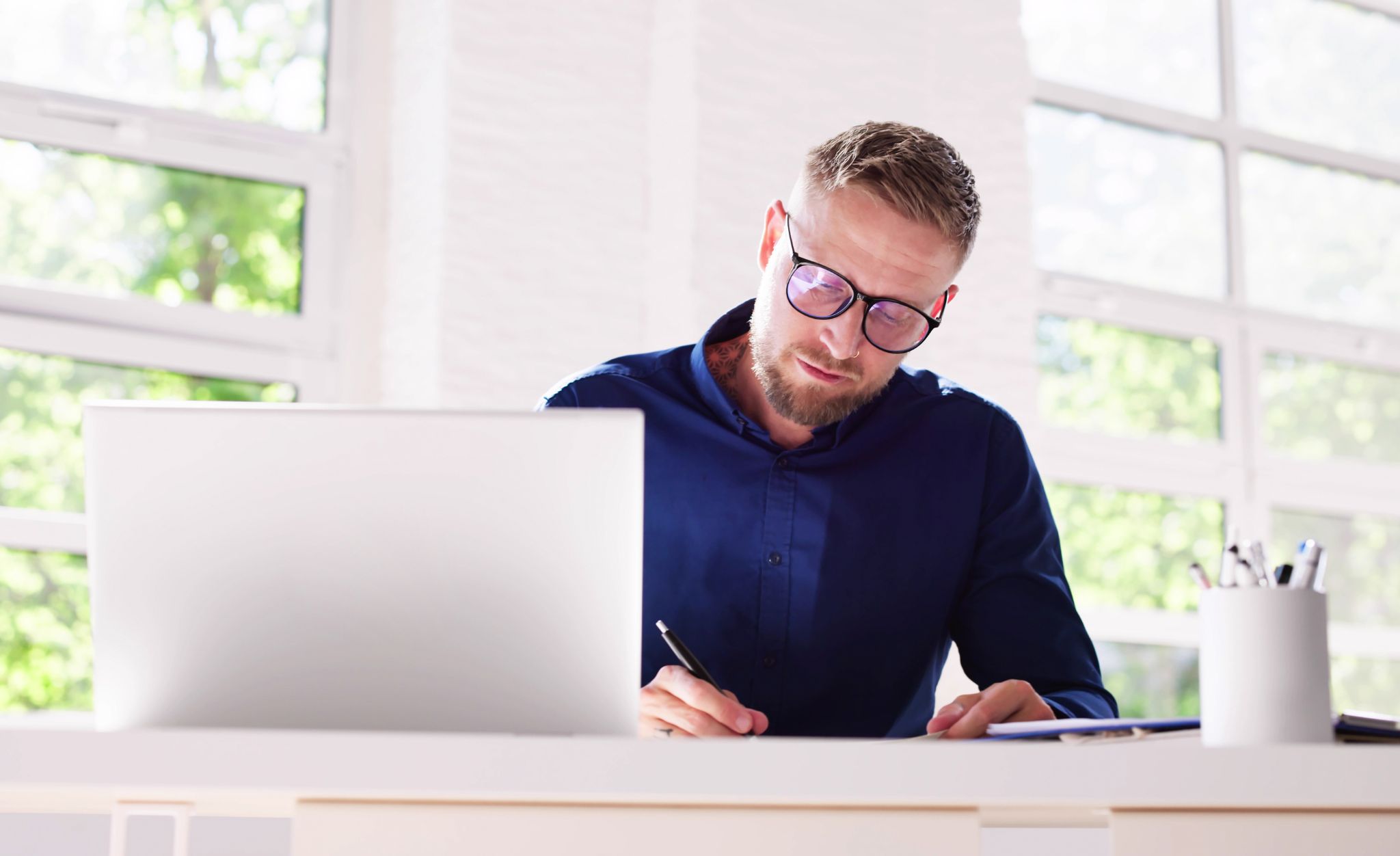 A man studies SQF training to strengthen his PCQI and HACCP programs.